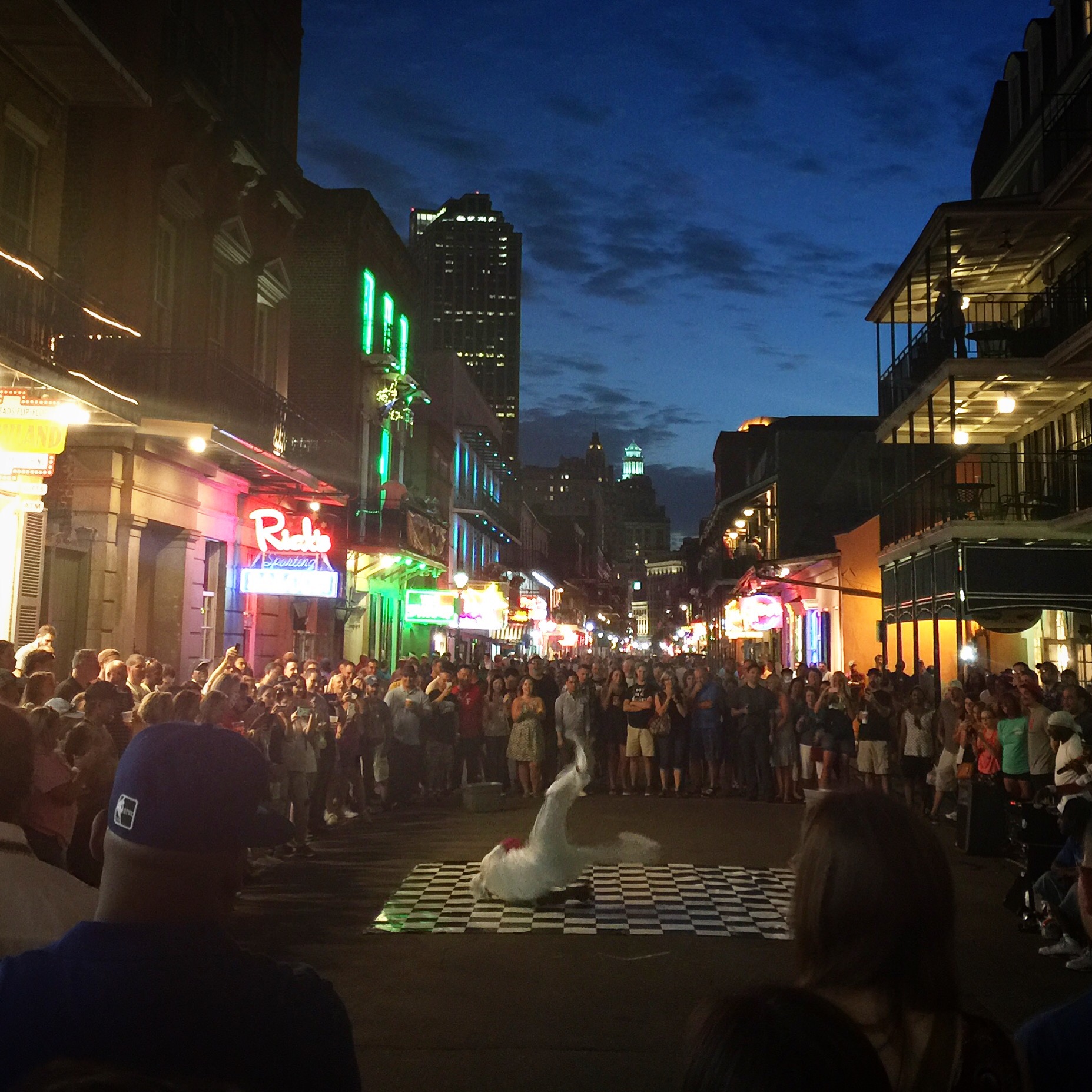 picture of a guy breakdancing on burbon street